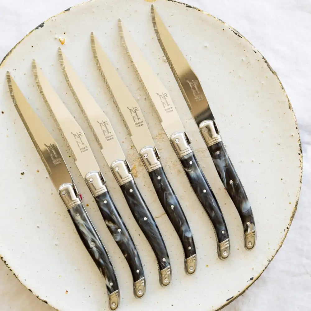 Set of Laguiole steak knives with black marble coloured plastic handle