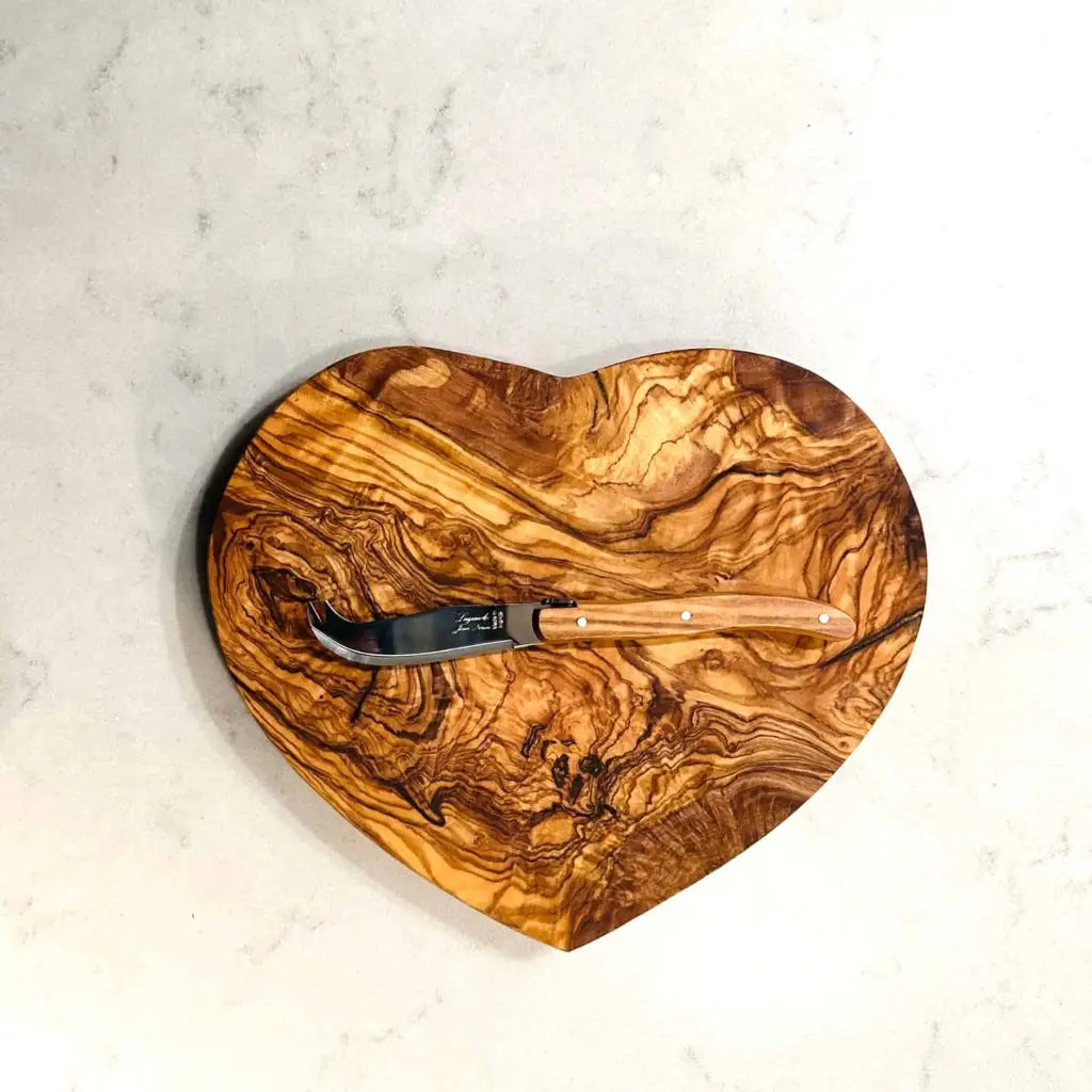 Heart shaped olive wood board made of sustainable olive wood from Tunisia and designed in France
