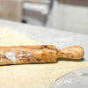close up rolling pin made of olive
