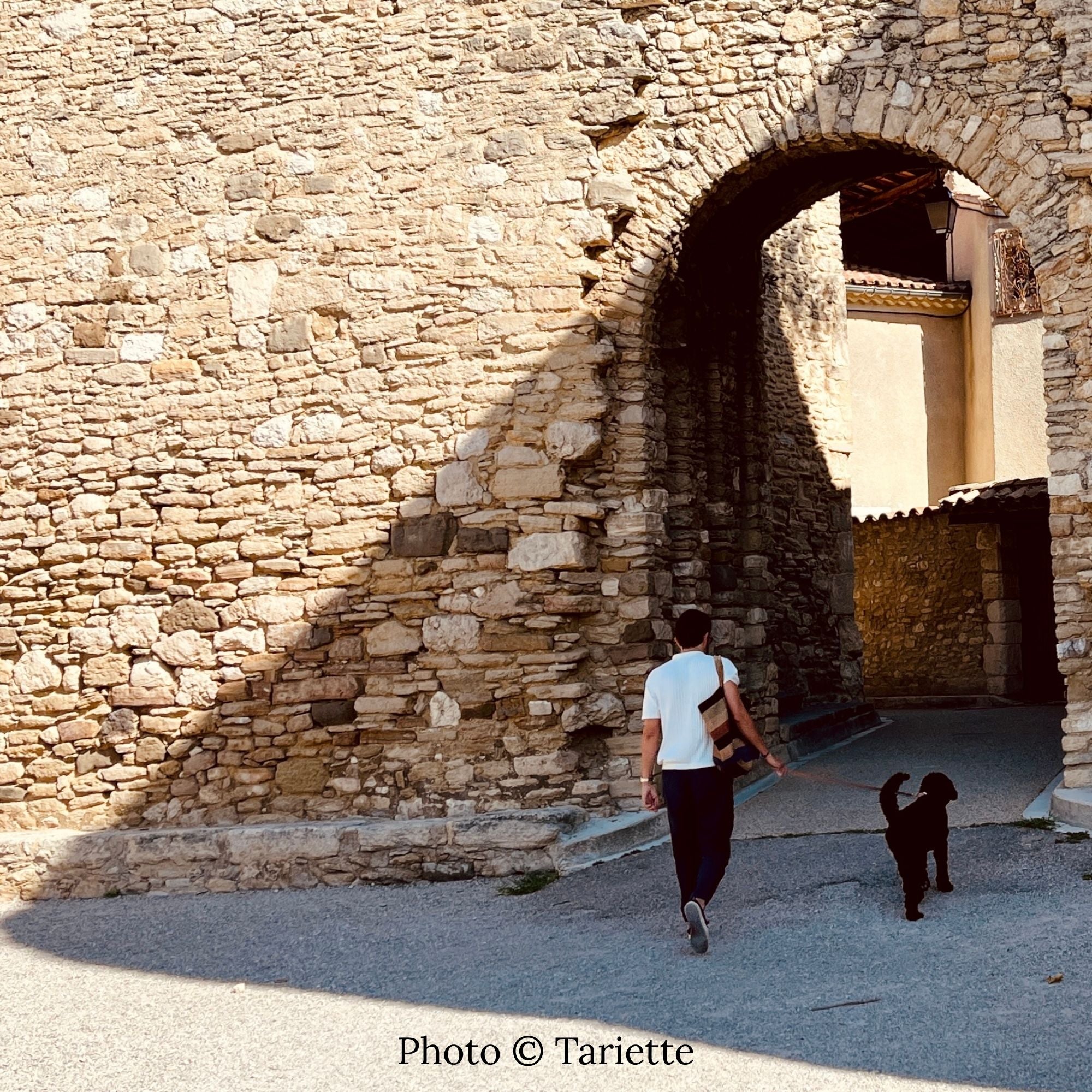 Venasque village in Provence with church, stone houses and views over the valley