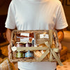 Happy customer carrying an apéro box from Tariette