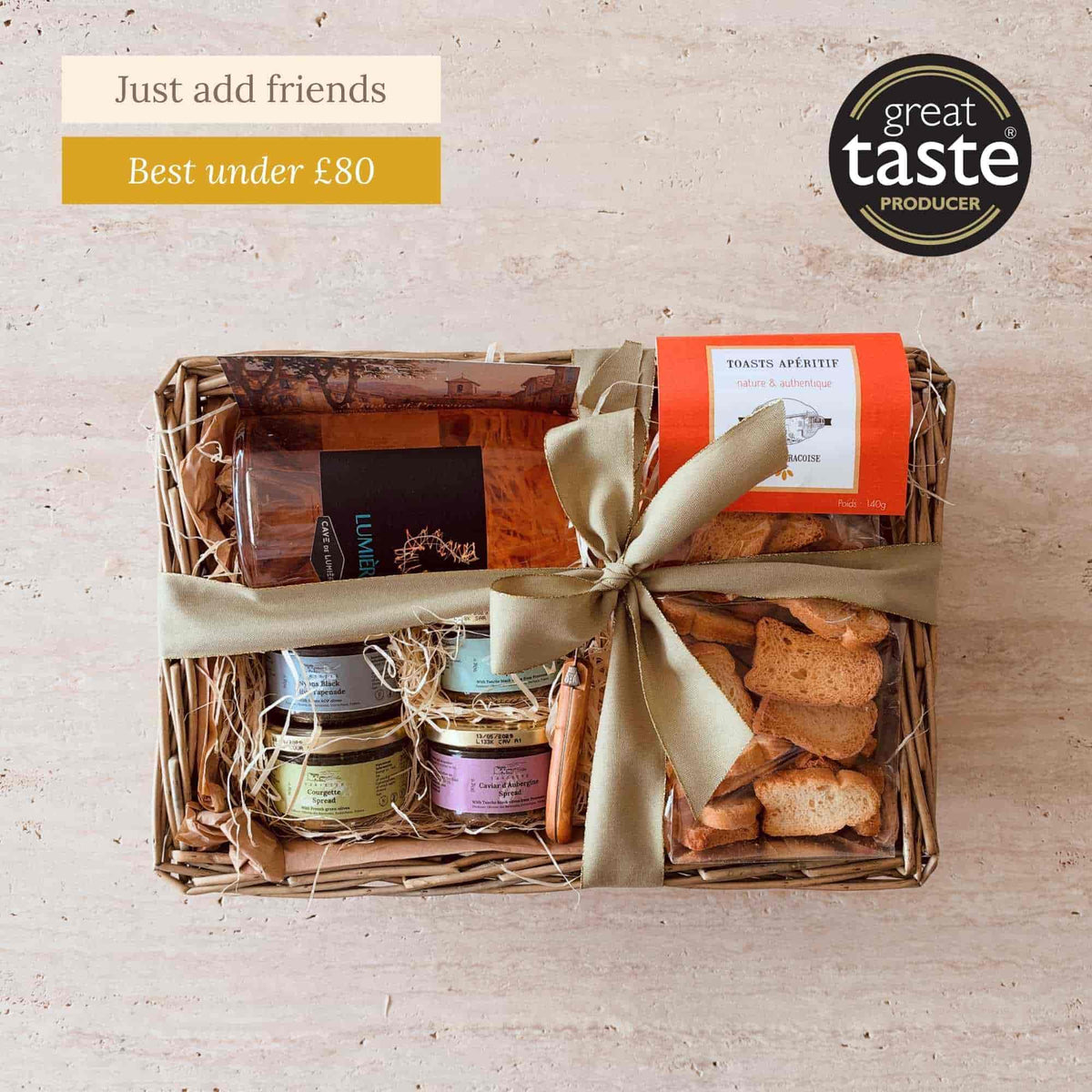 Tariette Apéro French food gift basket with rosé wine, savoury spreads, apéritif toasts and a Laguiole spread knife.