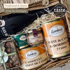 Close-up of the Barnabé hamper with Dordogne duck confit, duck cassoulet, terrine, rillettes, red wine and almonds.