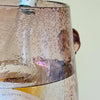 Rose coloured French glass wine bucket holding a bottle