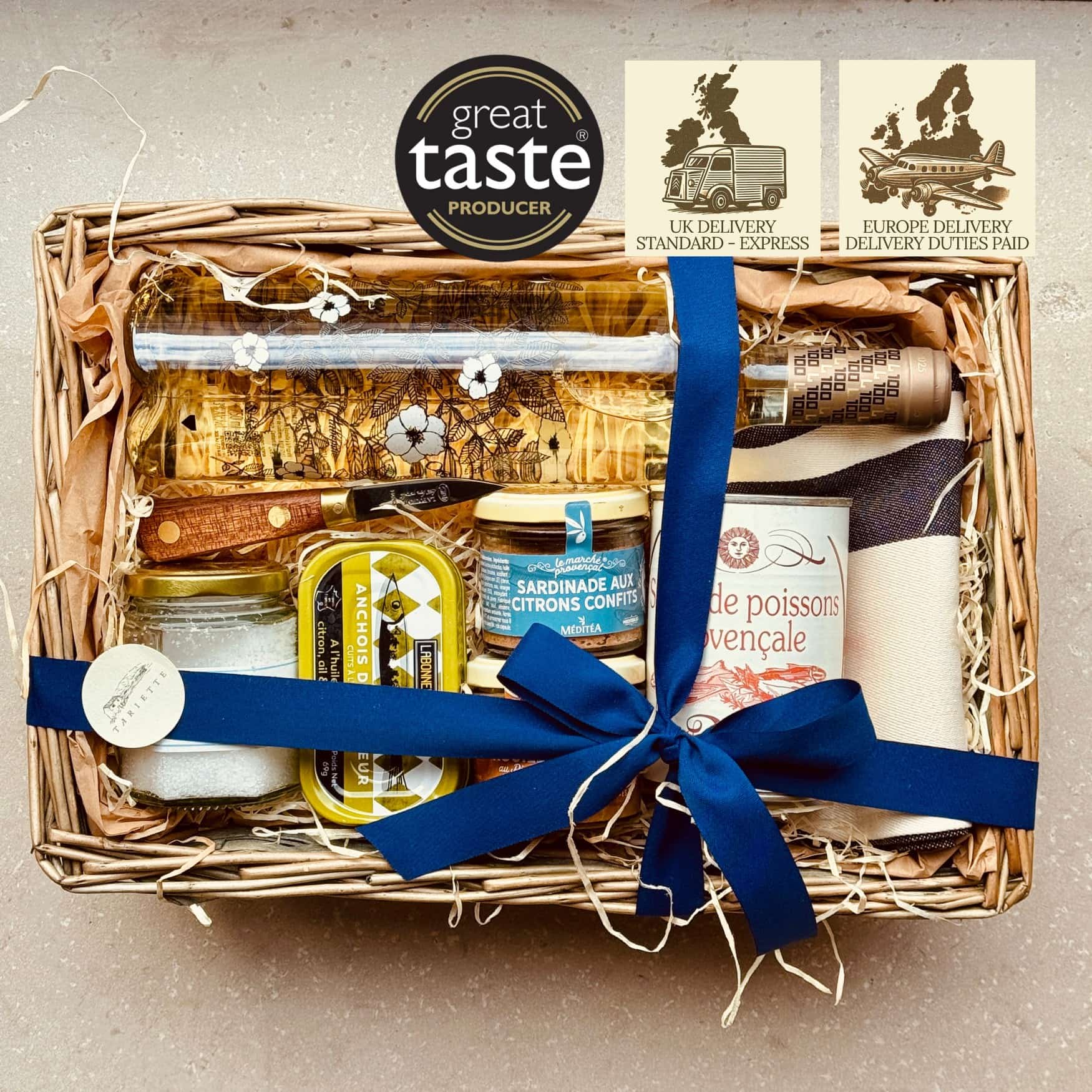 A Provençal apéro box filled with artisan spreads, terrines and crackers, paired with a southern French wine.