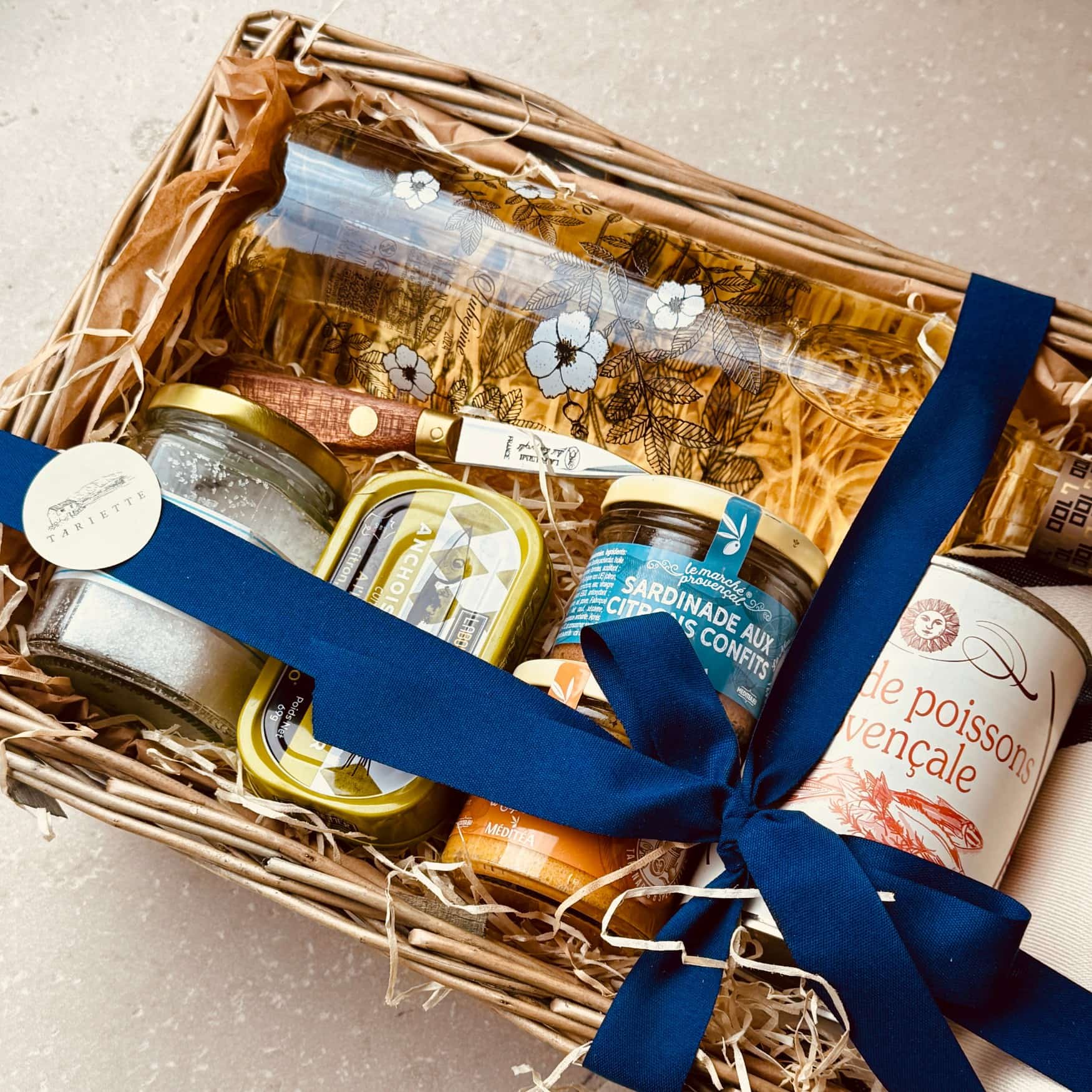 A gourmet apéro selection featuring artisan spreads, terrines, crackers and wine from southern France.