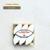 These traditional calissons are a Provençal confectionery made of ground almonds, candied melon, and orange zests, coated with royal icing. Available in a box of 6 or 12.
