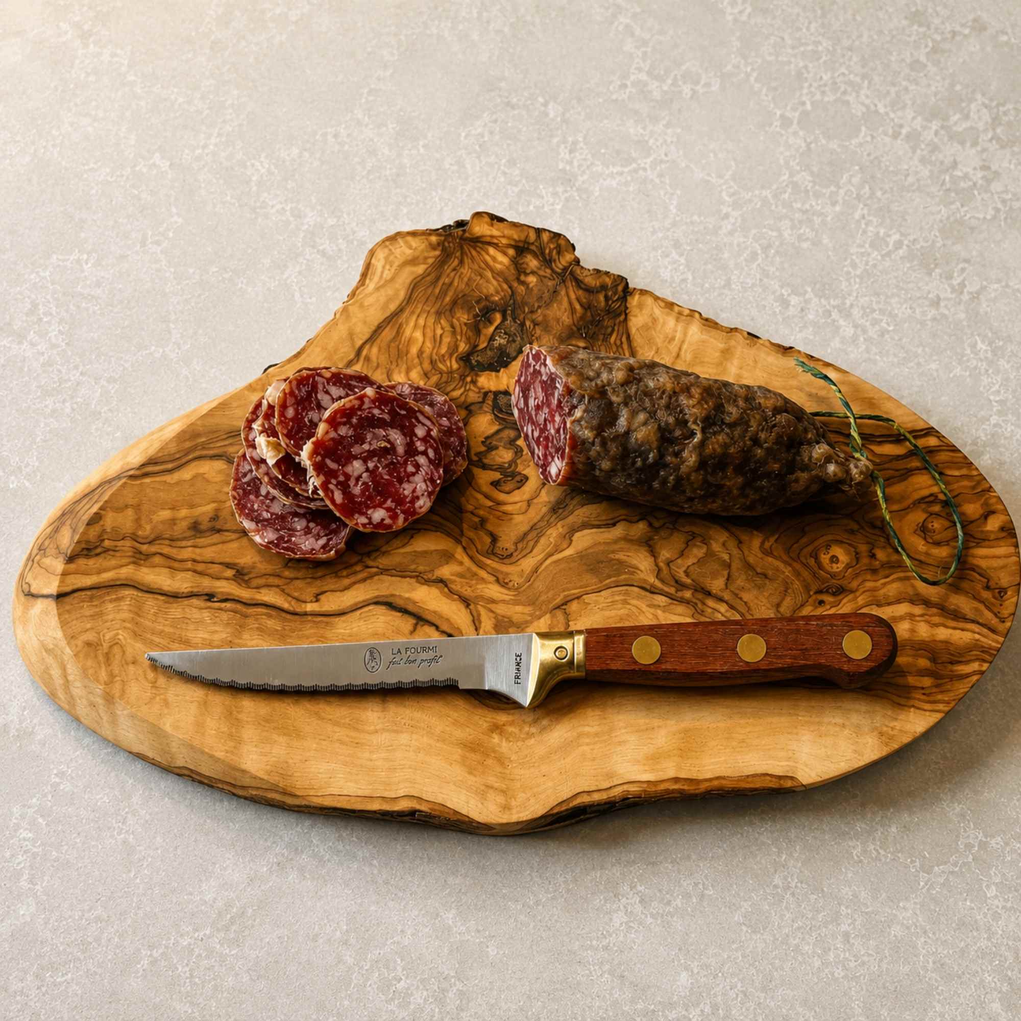 Kitchen knife made in France with serrated blade and rosewood handle
