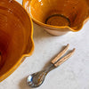 two tian salad bowls from Provence in bright yellow
