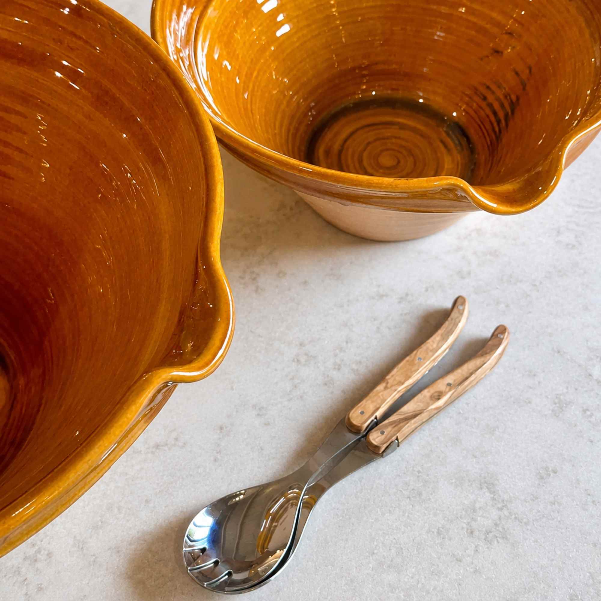 two tian salad bowls from Provence in bright yellow