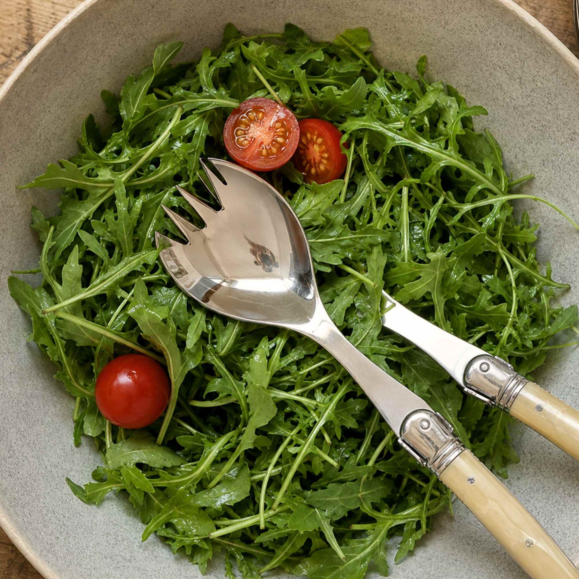 Laguiole salad servers with white horn handle made of plastic