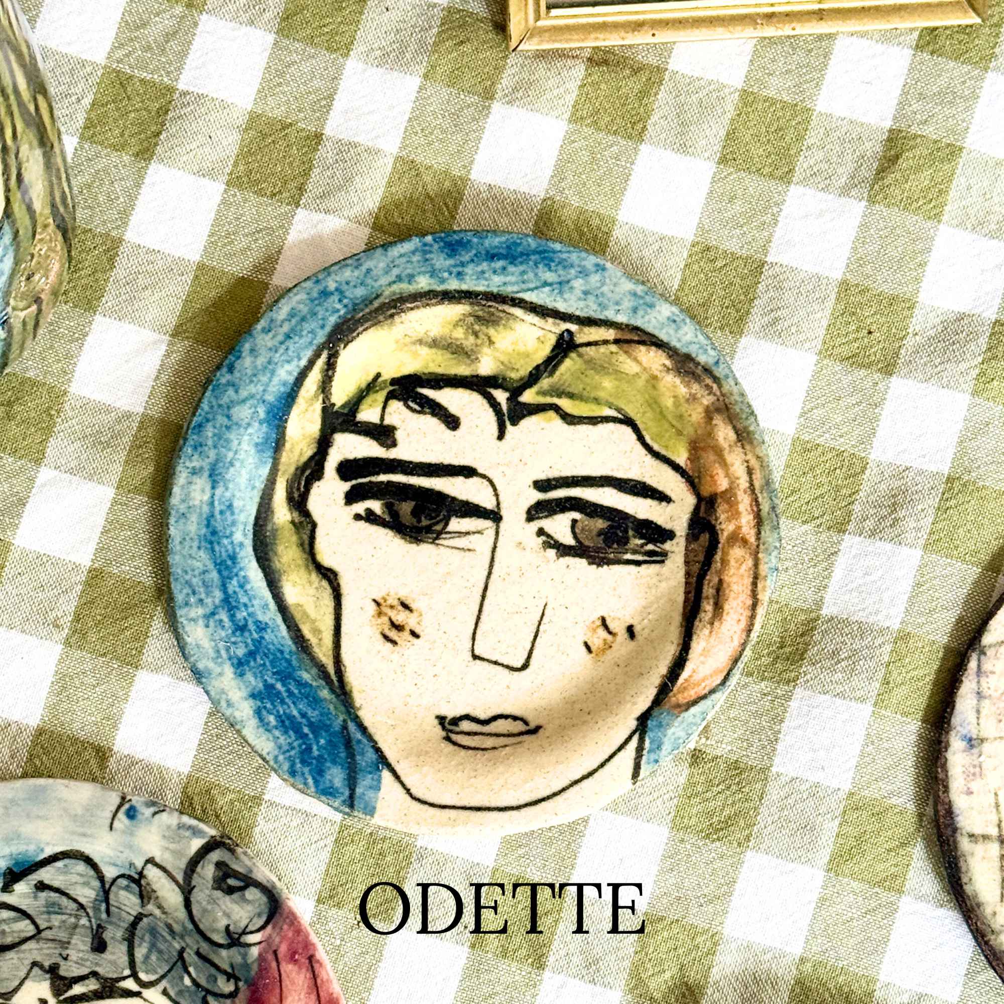 Odette, hand-painted plate with a lady's face by E.V.