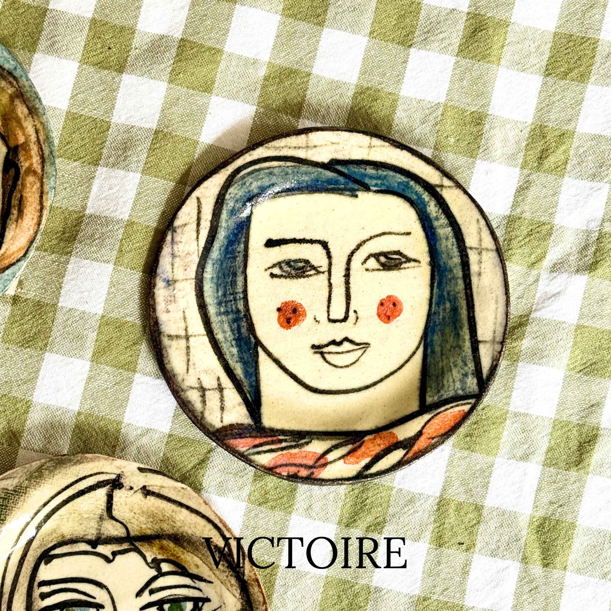 Victoire, hand-painted plate with a lady's face by E.V.