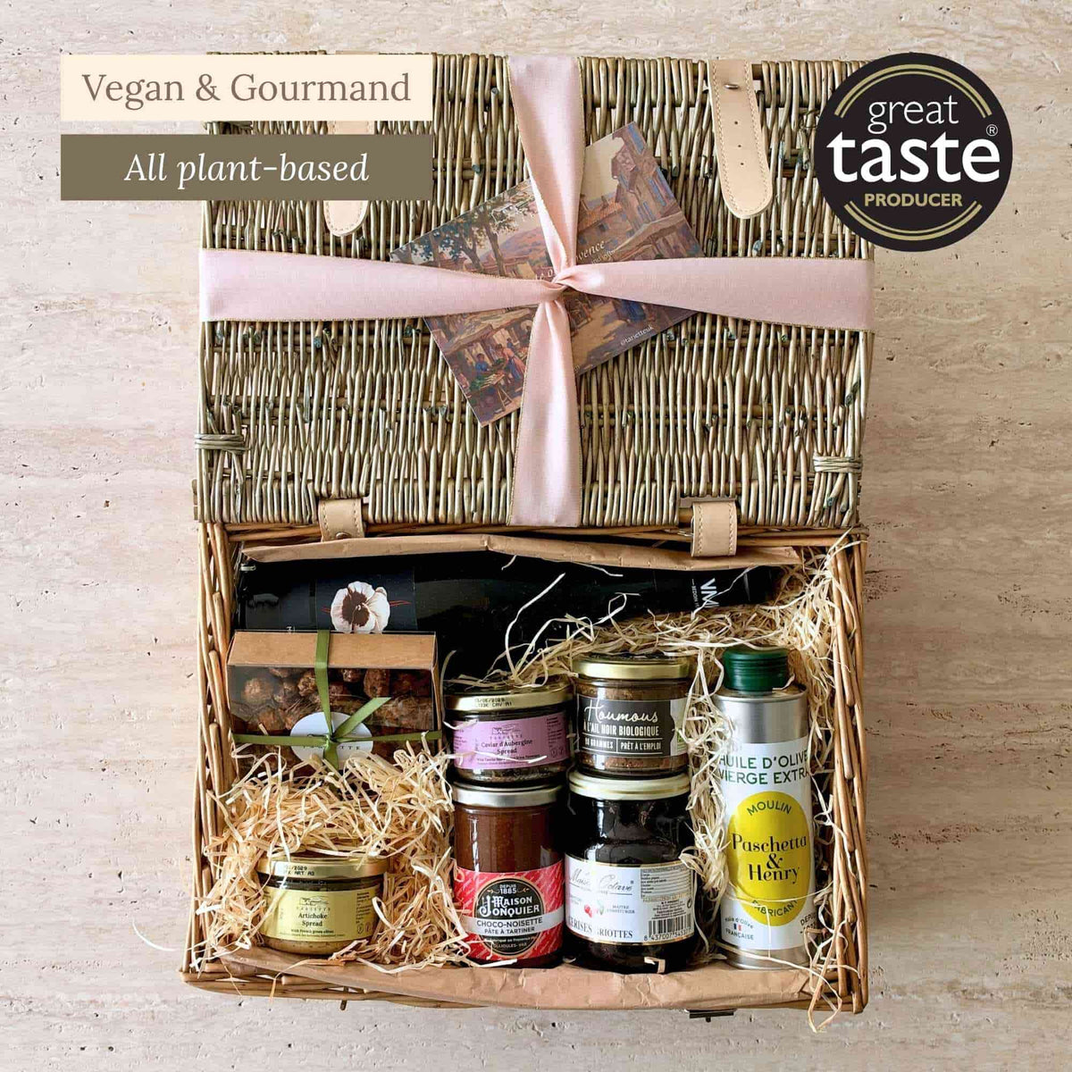 Tariette Lio vegan French food hamper open with red wine, olive oil, vegetable spreads, jam and caramelised almonds.