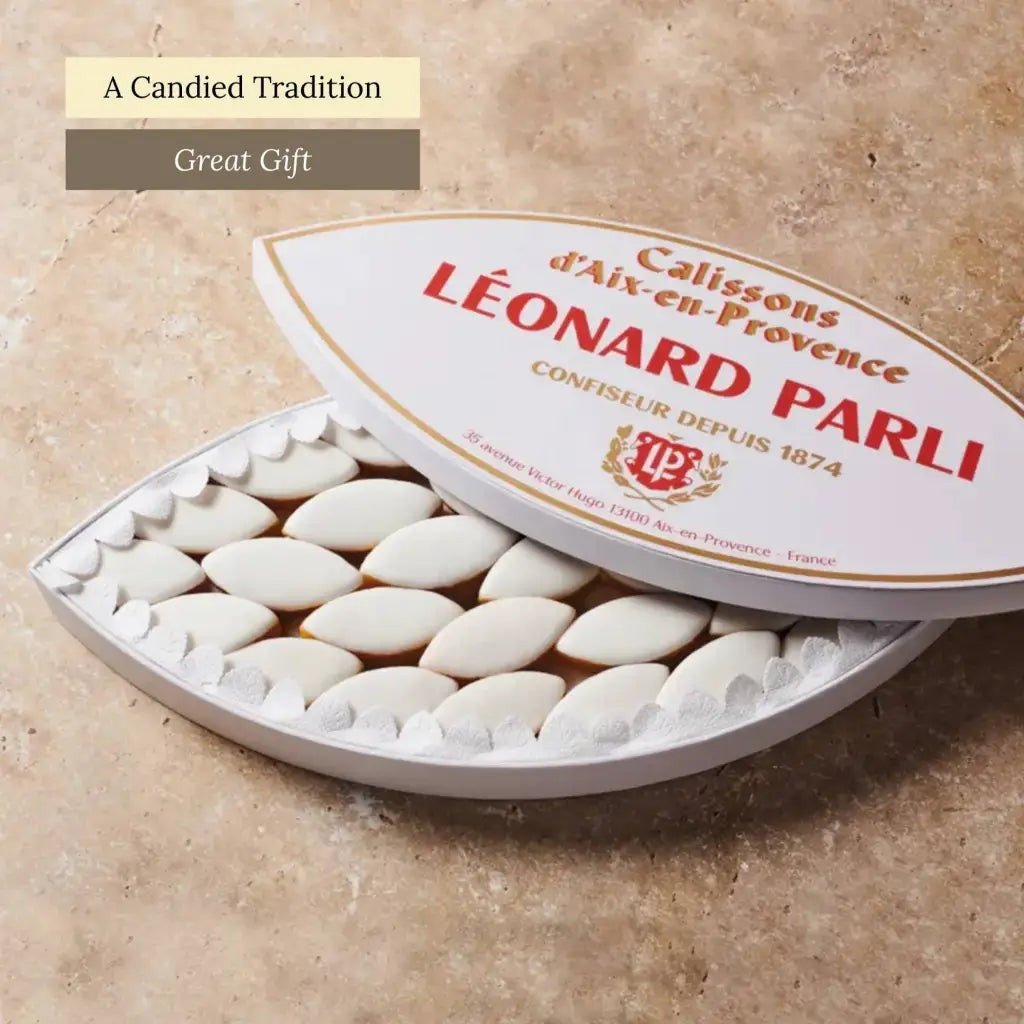 These classic calissons are a beloved Provençal treat, crafted from finely ground almonds, candied melon, and orange zest, then finished with a delicate royal icing. Box of 56.