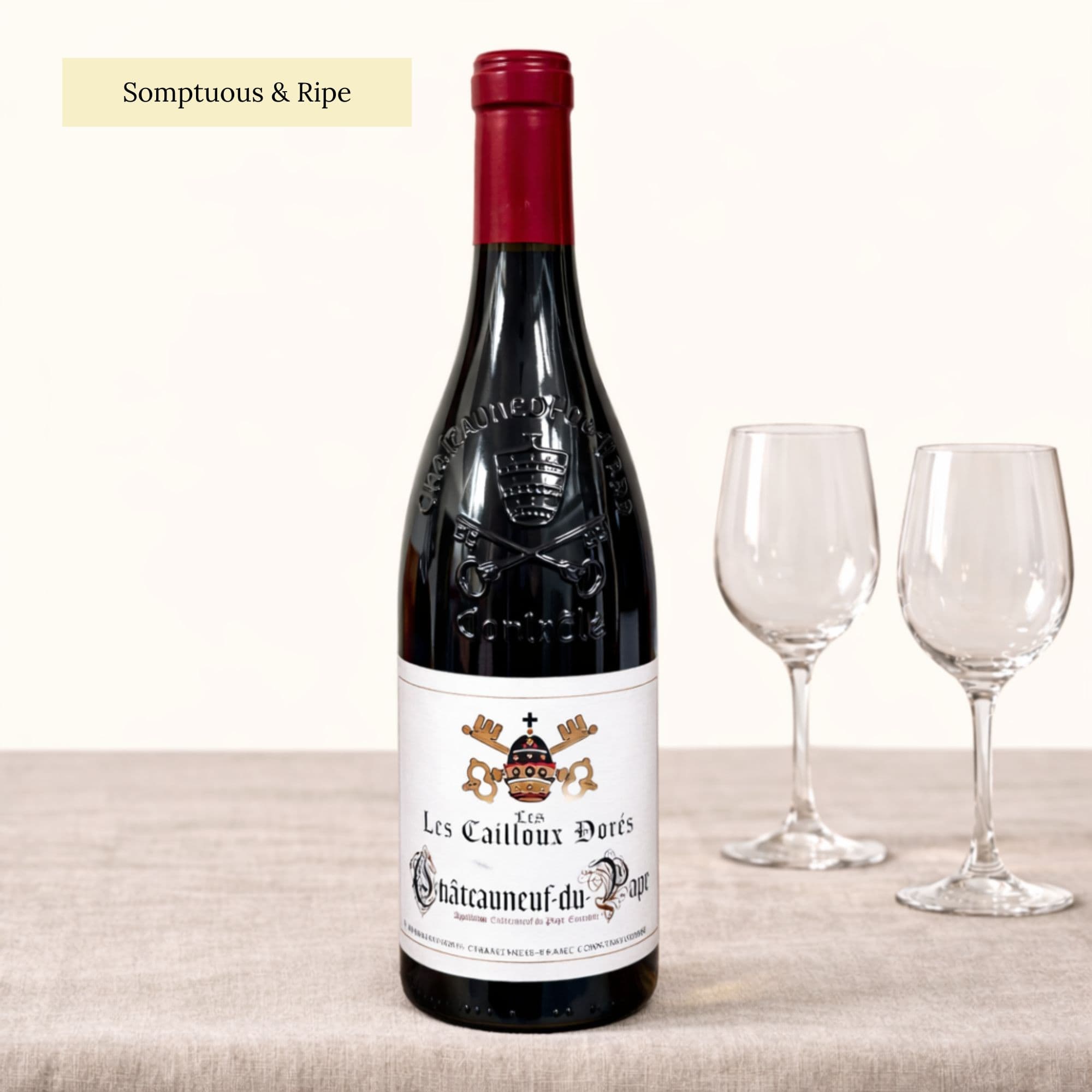 Châteauneuf du Pape Les Cailloux Dorés red wine bottle from Cave de Gigondas on natural linen background