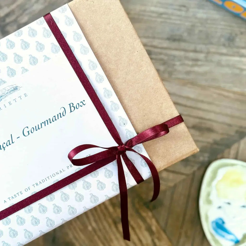Gift box with Provençal sweet treats including Calissons from Aix, chocolate coated almonds, Provence flower honey, vegan sweets and caramel lollies.