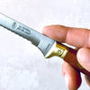 Kitchen knife with serrated blade