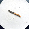 Laguiole spread knife on a board