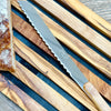 Laguiole bread knife on bread board