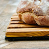 loaf of bread on bread board