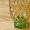 1960s cocktail glasses with diamond pattern and green feet