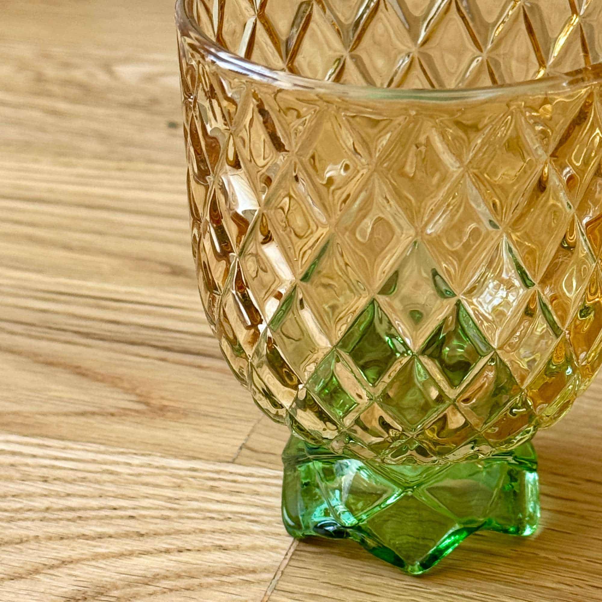 1960s cocktail glasses with diamond pattern and green feet