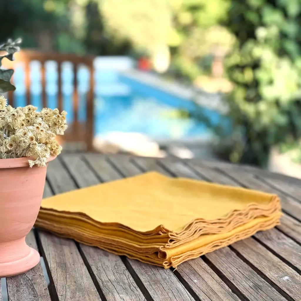 This set of 6 thick cotton napkins is a true Provençal find. Originally woven in a sturdy cotton, we’ve given them new life with a vibrant ochre-yellow dye, a colour that feels at once timeless and deeply Provençal.