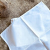 Charming set of 6 French cotton napkins, each delicately embroidered with a small pastel flower motif. 