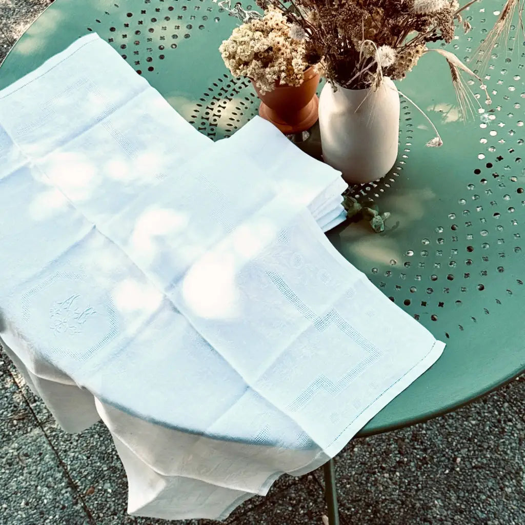 A beautiful set of French damask cotton napkins, woven with an intricate floral motif 