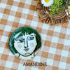 Small plate with painted ladies faces by Elisabeth V. –