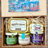 Artisan savoury gift selection from Provence featuring olive tapenade, aubergine spread, venison and mushroom pâté, duck terrine and sardines in olive oil.