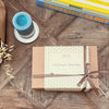 Provençal savoury hamper with green olive tapenade, vegan aubergine spread, venison pâté, duck terrine and sardines in olive oil, elegantly gift wrapped.