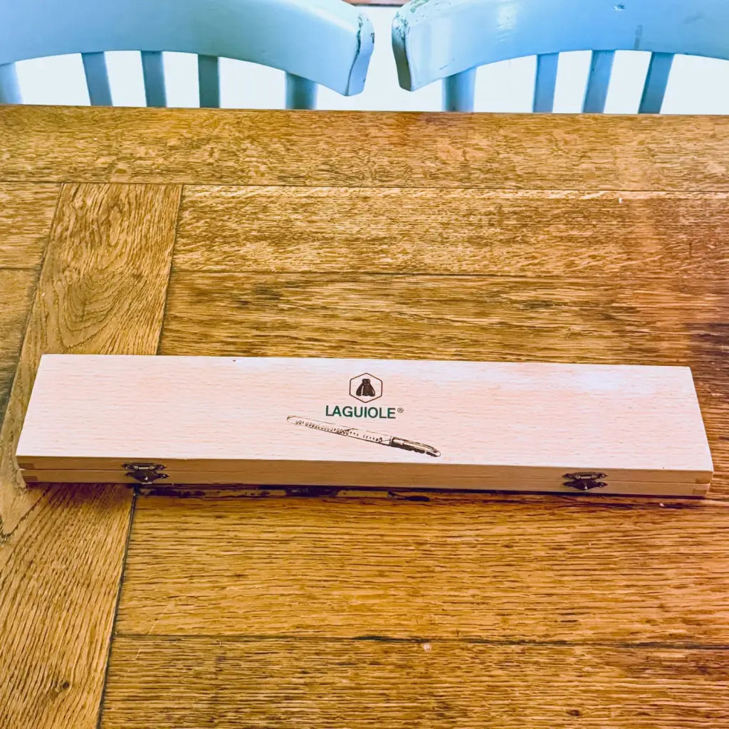 Vintage Laguiole carving knife. It remains in excellent condition and appears unused, presented in its original wooden box - perfect addition for collectors or discerning cooks.