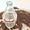 Charming vintage St Raphaël water carafe from the 1960s, made of clear pressed glass with a striking diamond pattern and the iconic red St Raphaël Apéritif lettering across a white enamel band. 