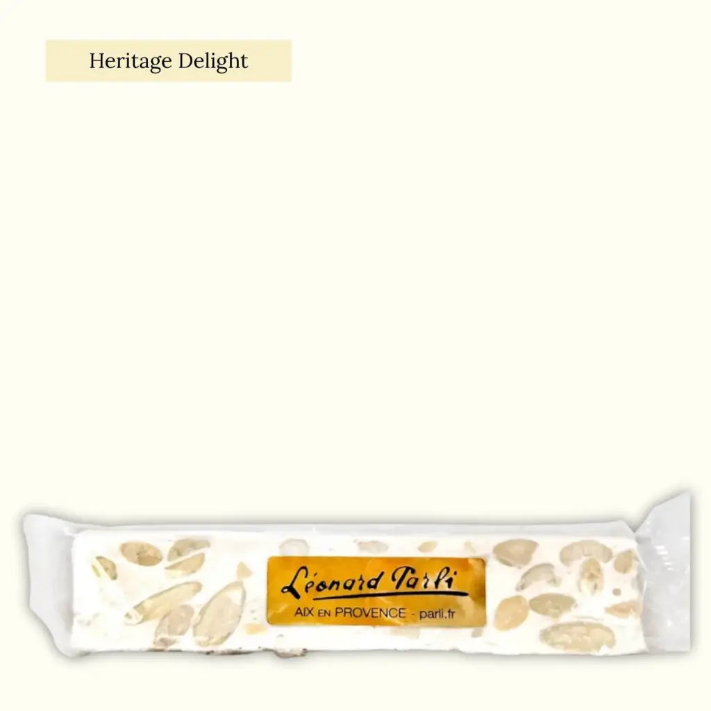 Traditional Provençal white nougat is a confectionery made with lavender honey, grilled almonds, and sugar mixed with egg whites and syrup.
